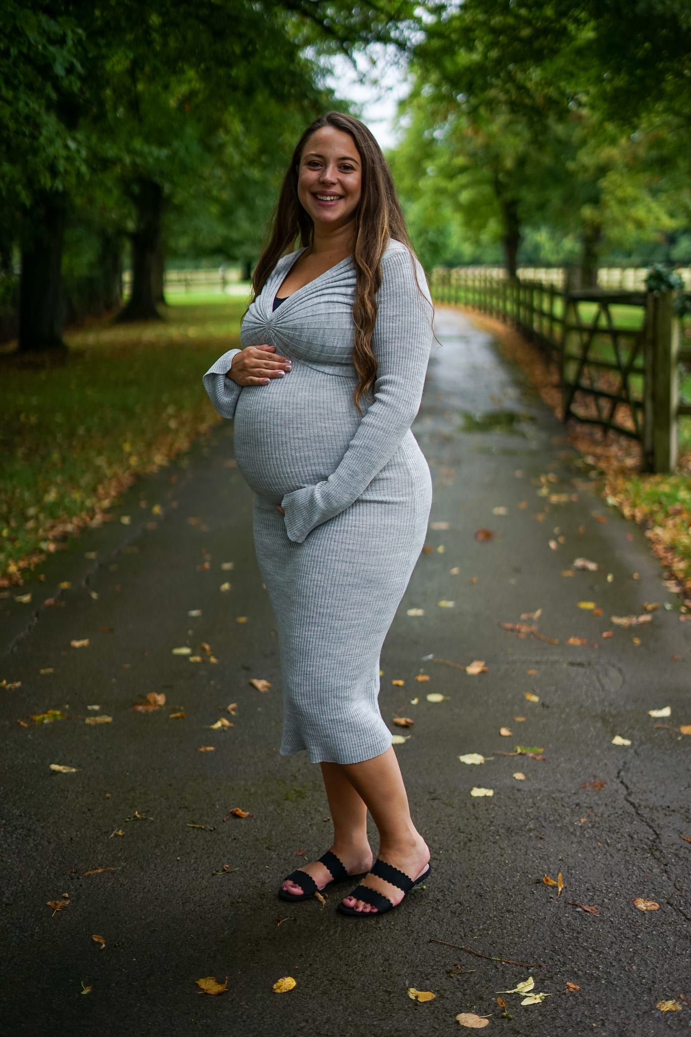 Mum to be holding her bump on a on a Maternity Shoot