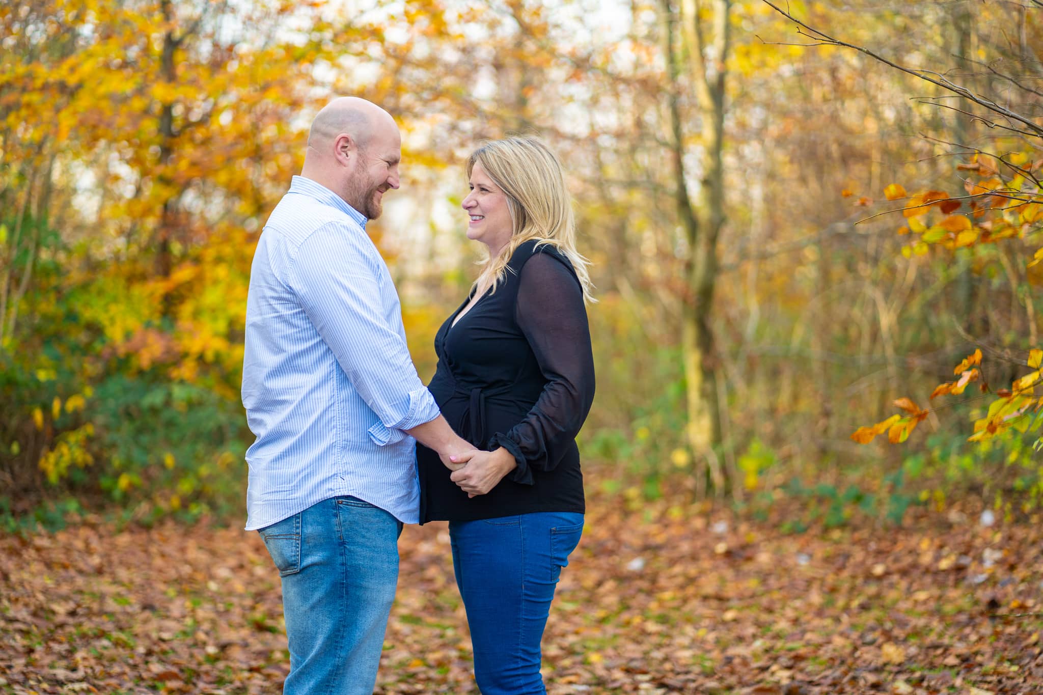 Couple holding hands on a Maternity Shoot