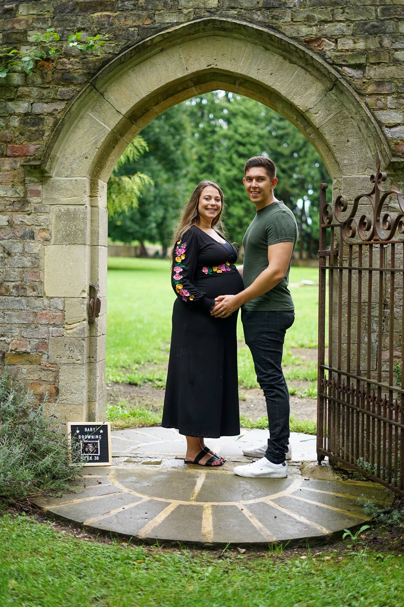 Couple holding hands on a Maternity Shoot